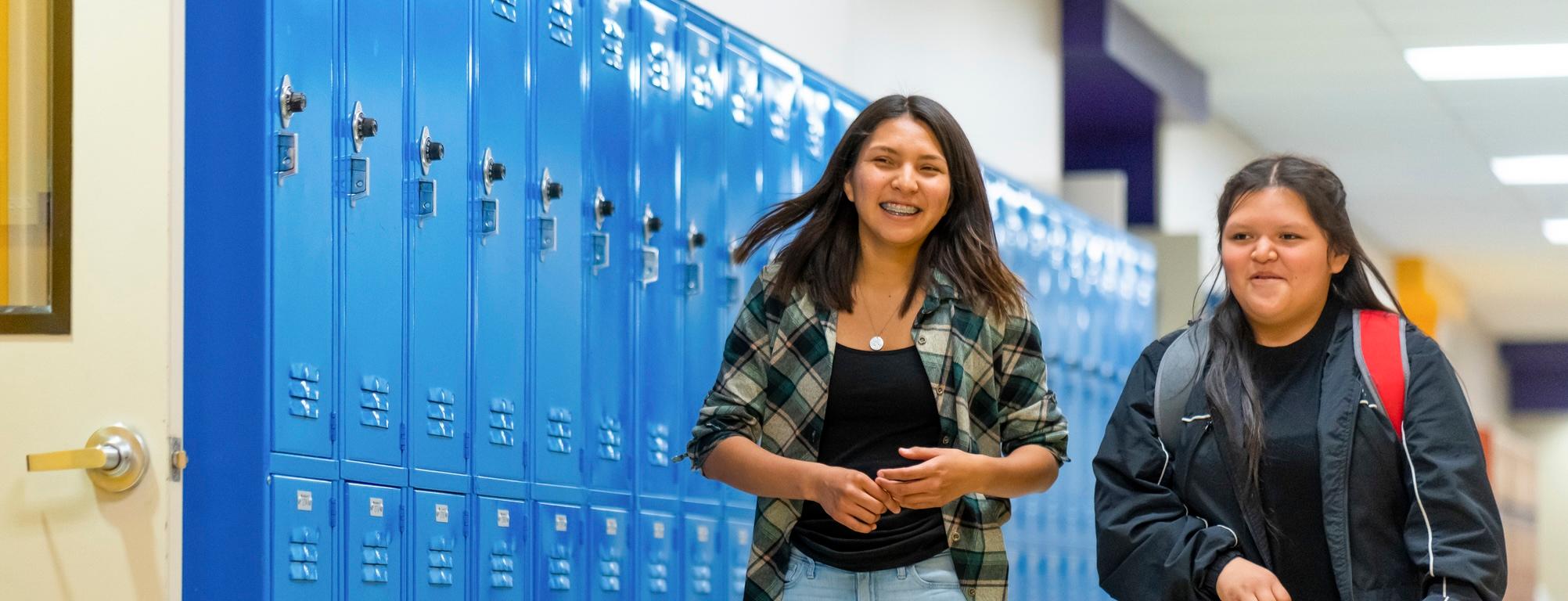 Two high school students in hallway