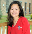 Student Smiling wearing SB logo sweatshirt and hat