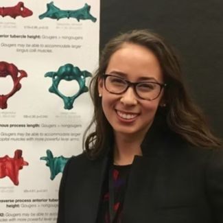 IDPAS student Abigail Nishimura at her research poster