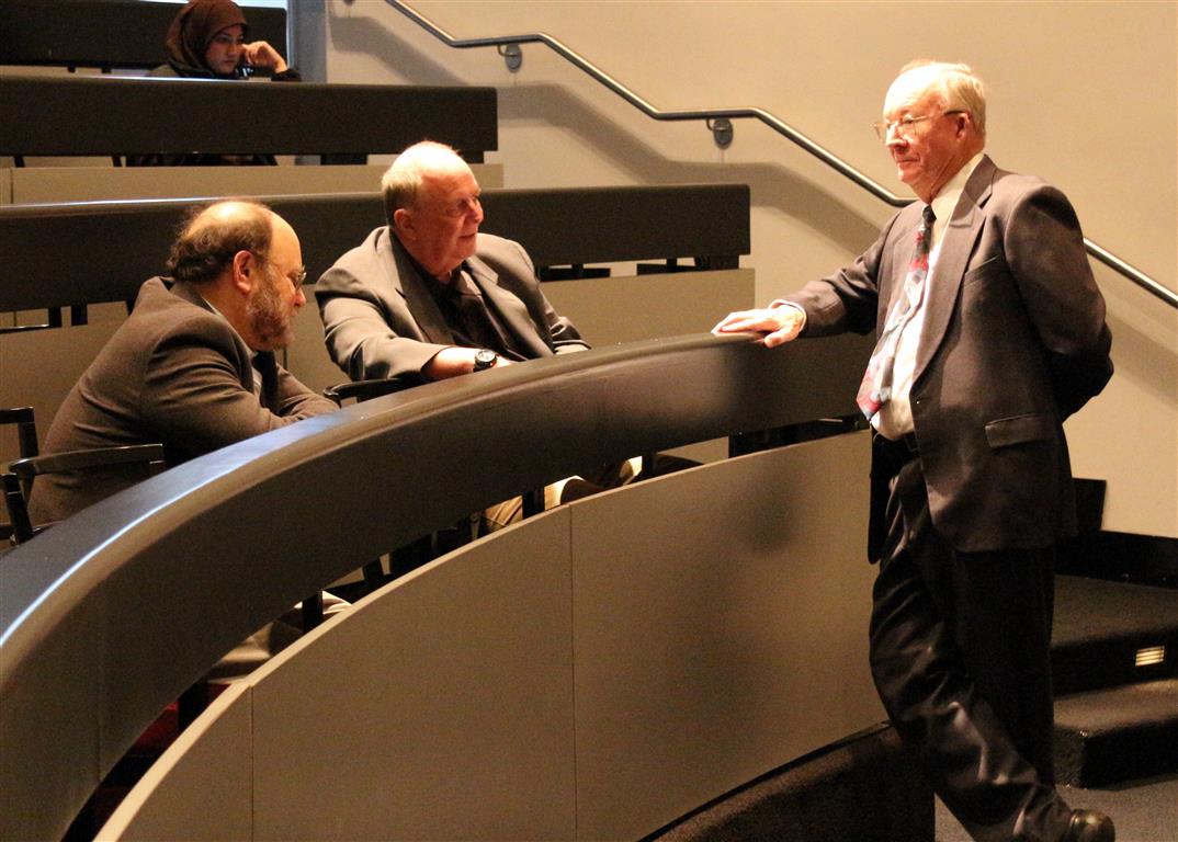 Bookstein, Jungers, and Rohlf chatting at the front of the lecture hall