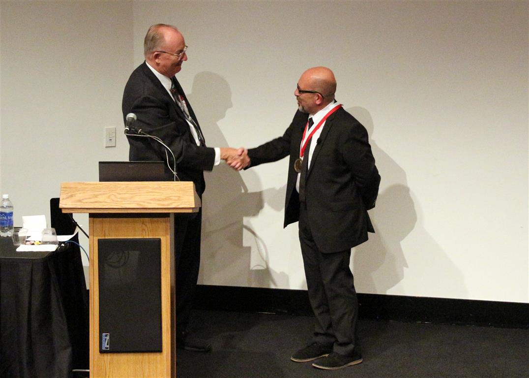 F. James Rohlf congratulating Paul O'Higgins