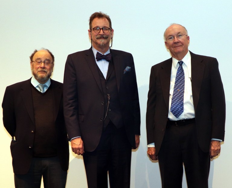 Dennis Slice wearing his medal, standing with Fred L. Bookstein and F. James Rohlf