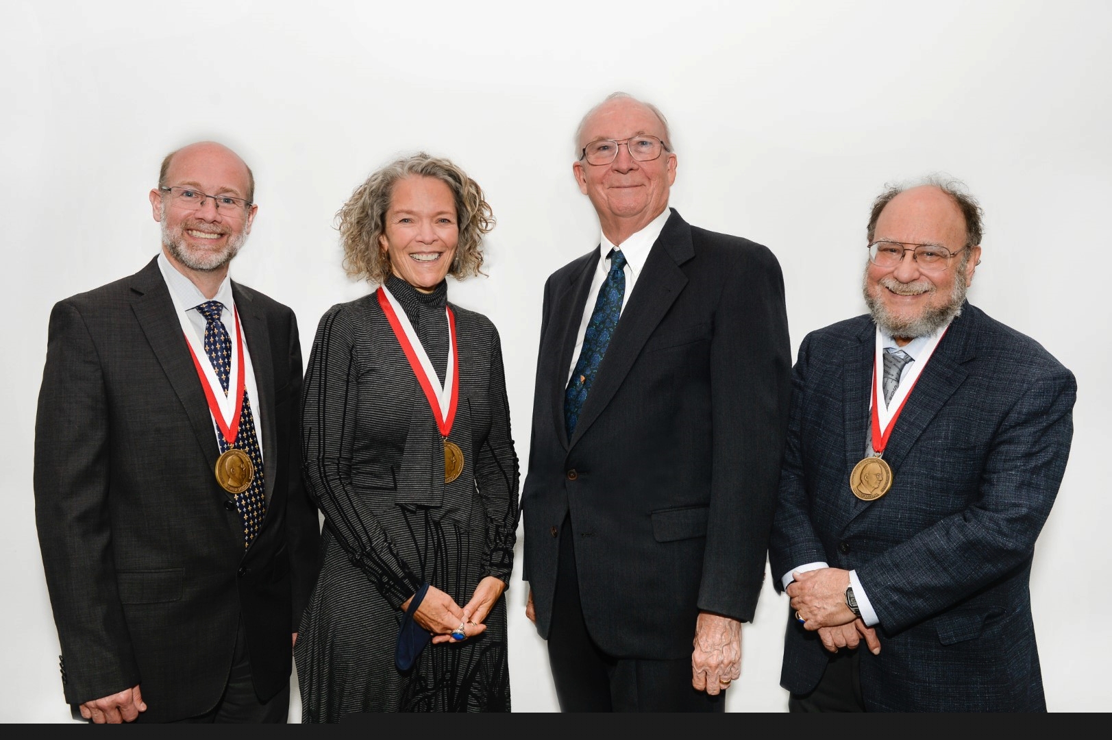 A group photograph of Dean Adams, Joan Richtsmeier, Jim Rohlf, and Fred Bookstein