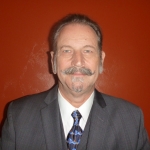 A headshot of Dennis Slice