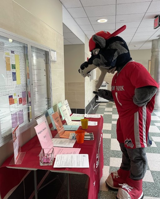 this is a photo of Wolfie attending an open house event for majors and minors