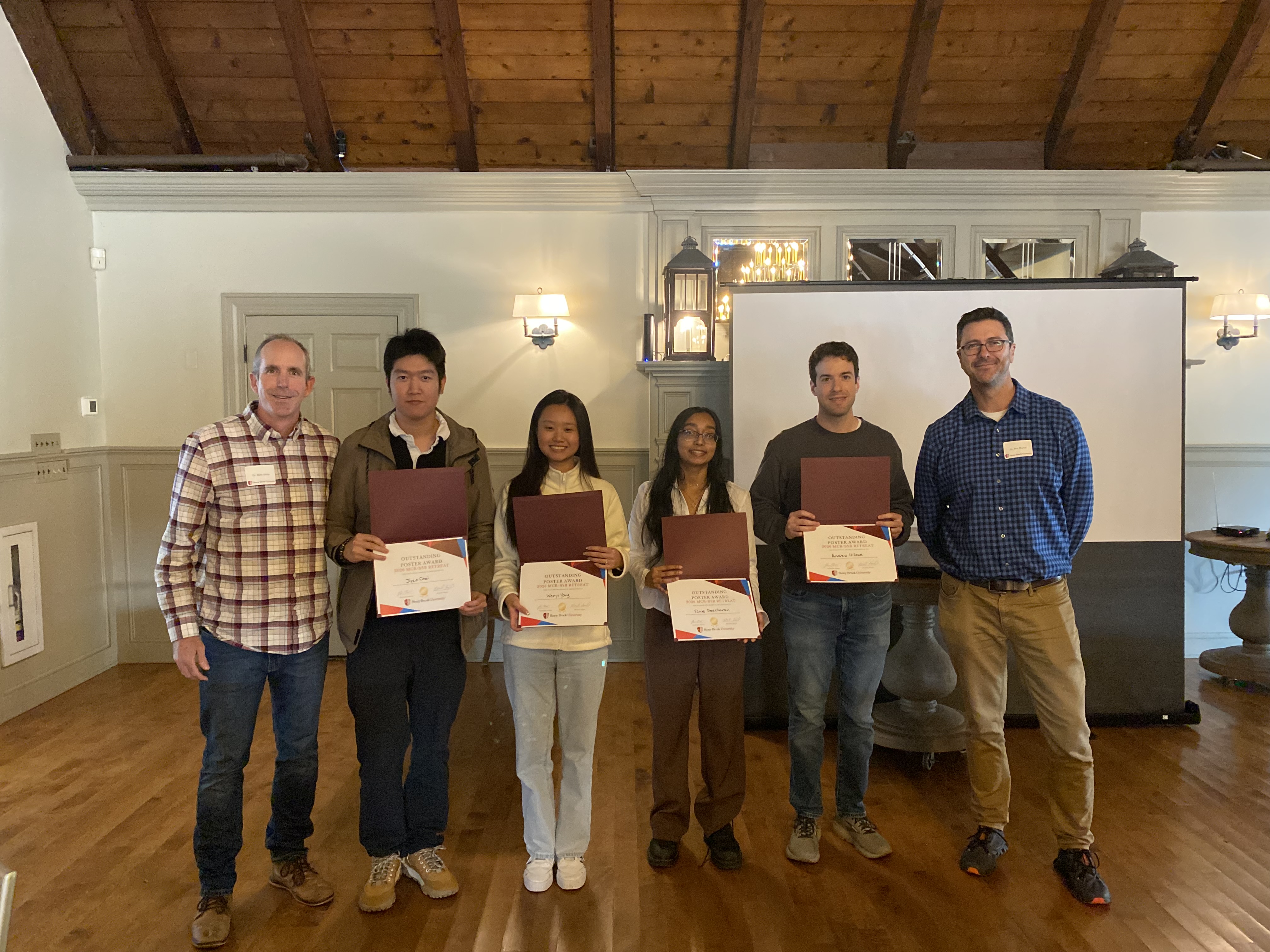 people holding certificates