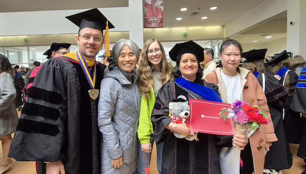 Doctoral hooding ceremony celebration