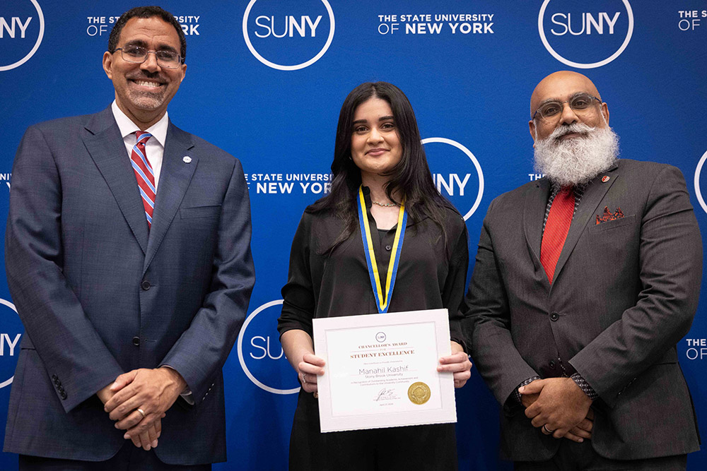 Stony Brook University biochemistry major Manahil Kashif (center) was one of 14 SBU students honored with the SUNY Chancellor’s Award for Student Excellence. She was joined by SUNY Chancellor John B. King Jr. (left) and SBU Assistant Chief Diversity Officer Usama M. Shaikh. Photos courtesy of SUNY.
