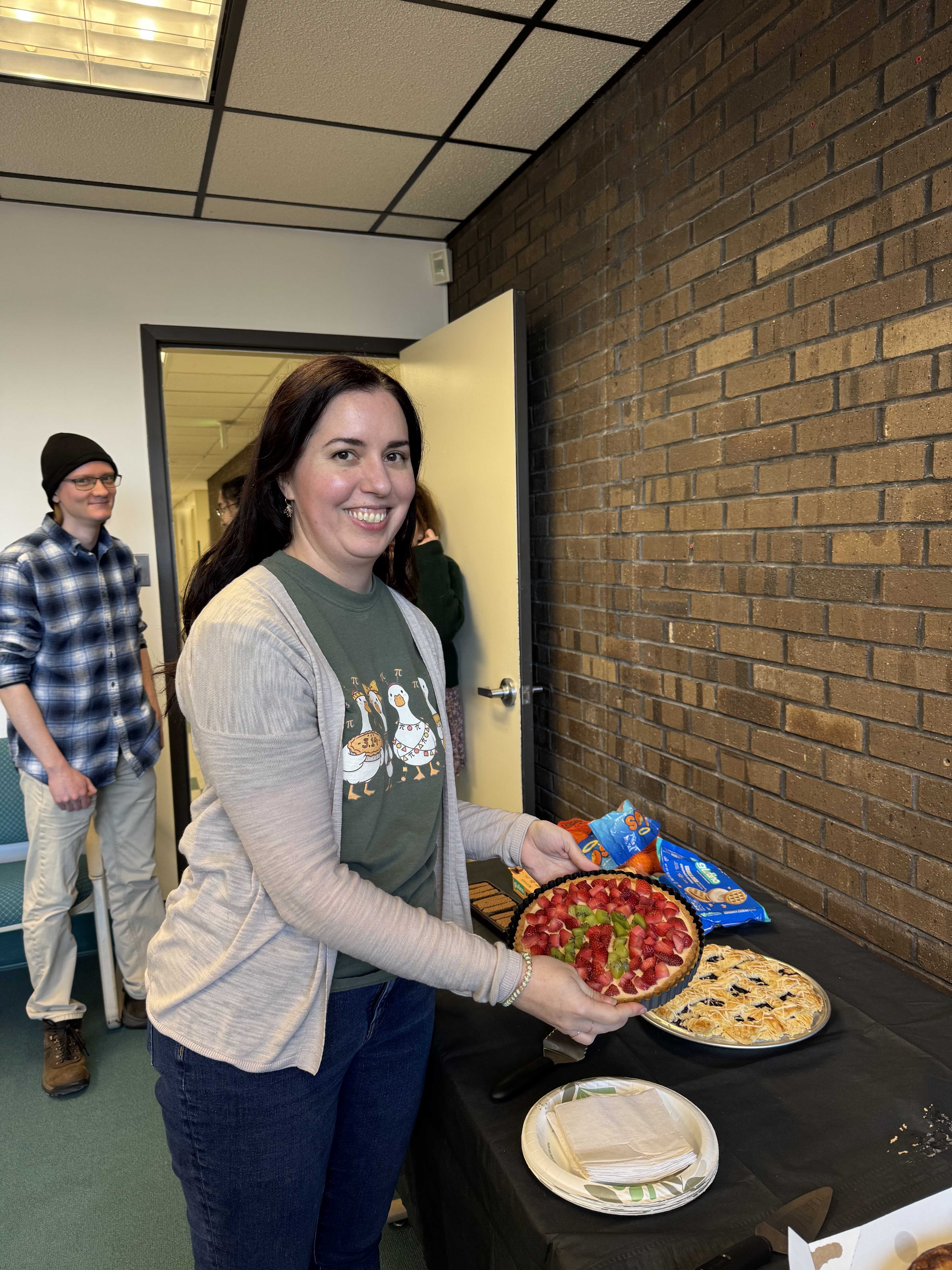 Julia Rogers with fresh fruit on a black tea panacotta pie