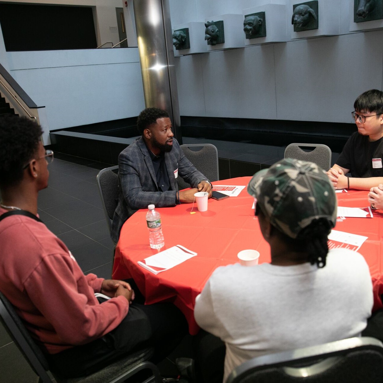 students and advisor at college of business event