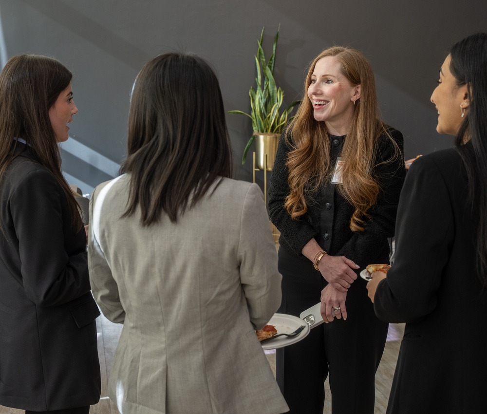 students talking with industry member