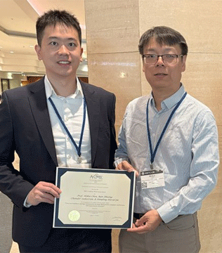 Two men stand indoors, smiling. One holds a certificate from ASME. 