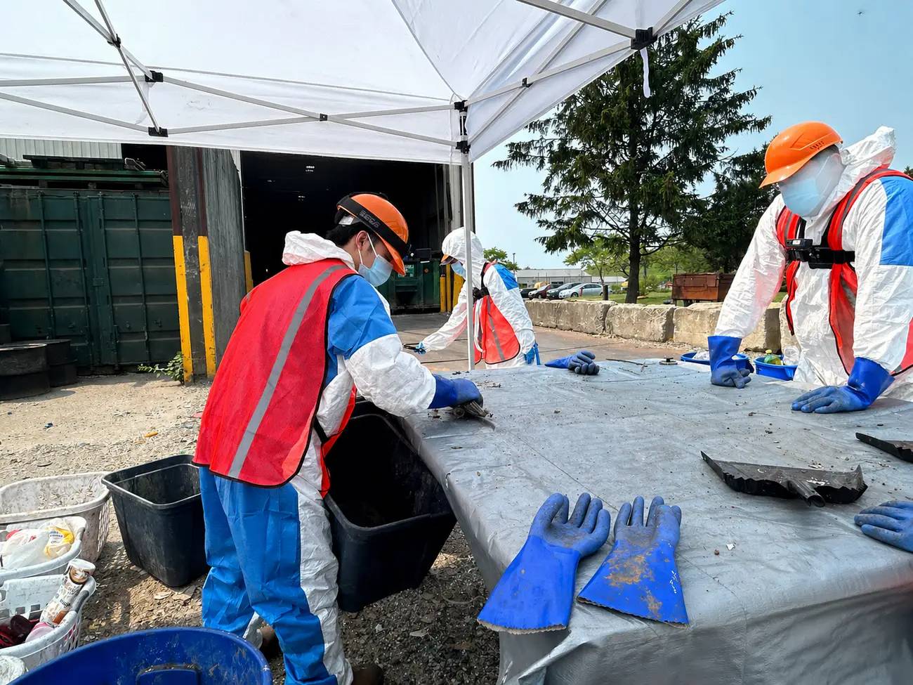 Researchers from the Waste Data and Analysis Center wear GoPro cameras as they sort and characterize municipal solid waste. Ruwen Qin/Stony Brook University