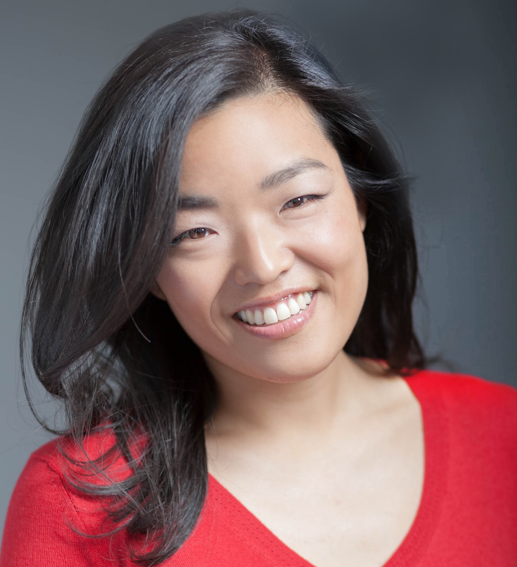 Patricia Park smiling in a red shirt