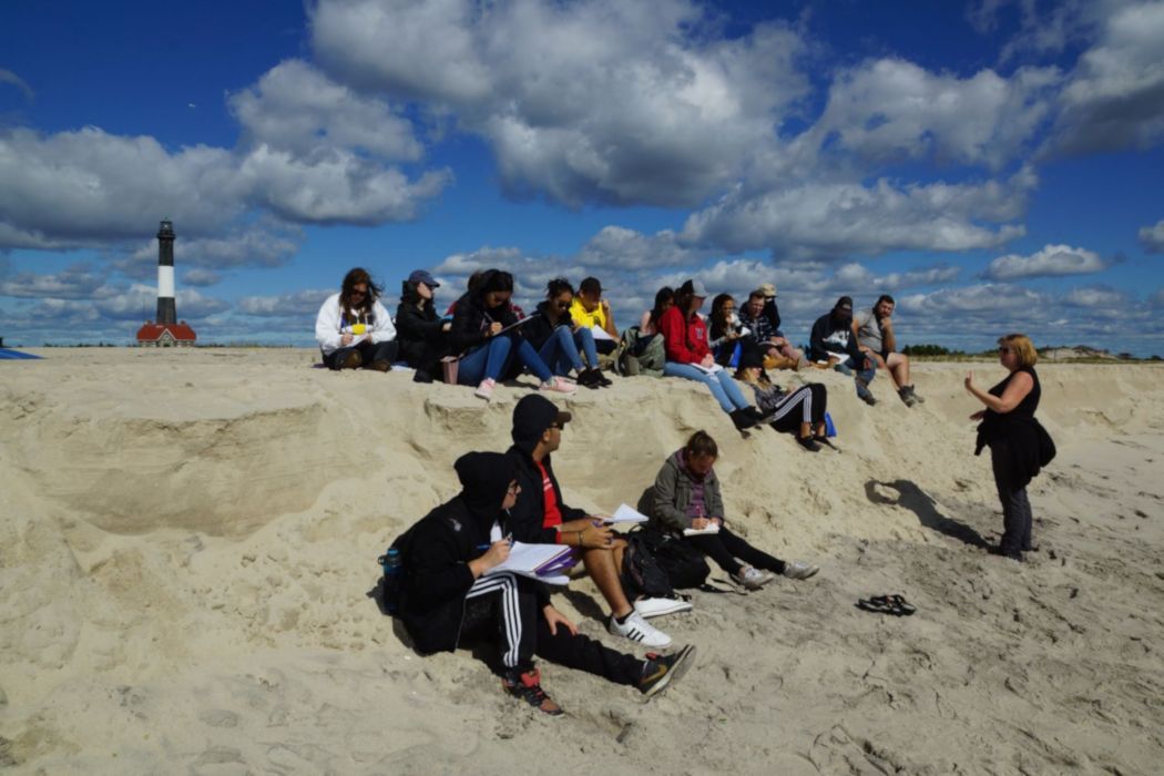 Dr. Tara Rider and students hold class on a Fire Island sand dune