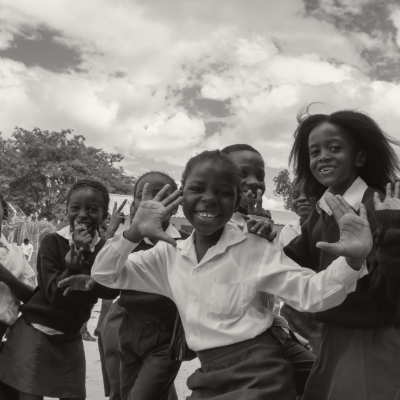 group of children holding each other hands