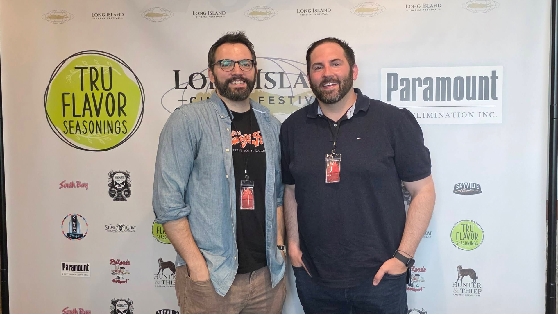Famulari brothers in front of a step and repeat