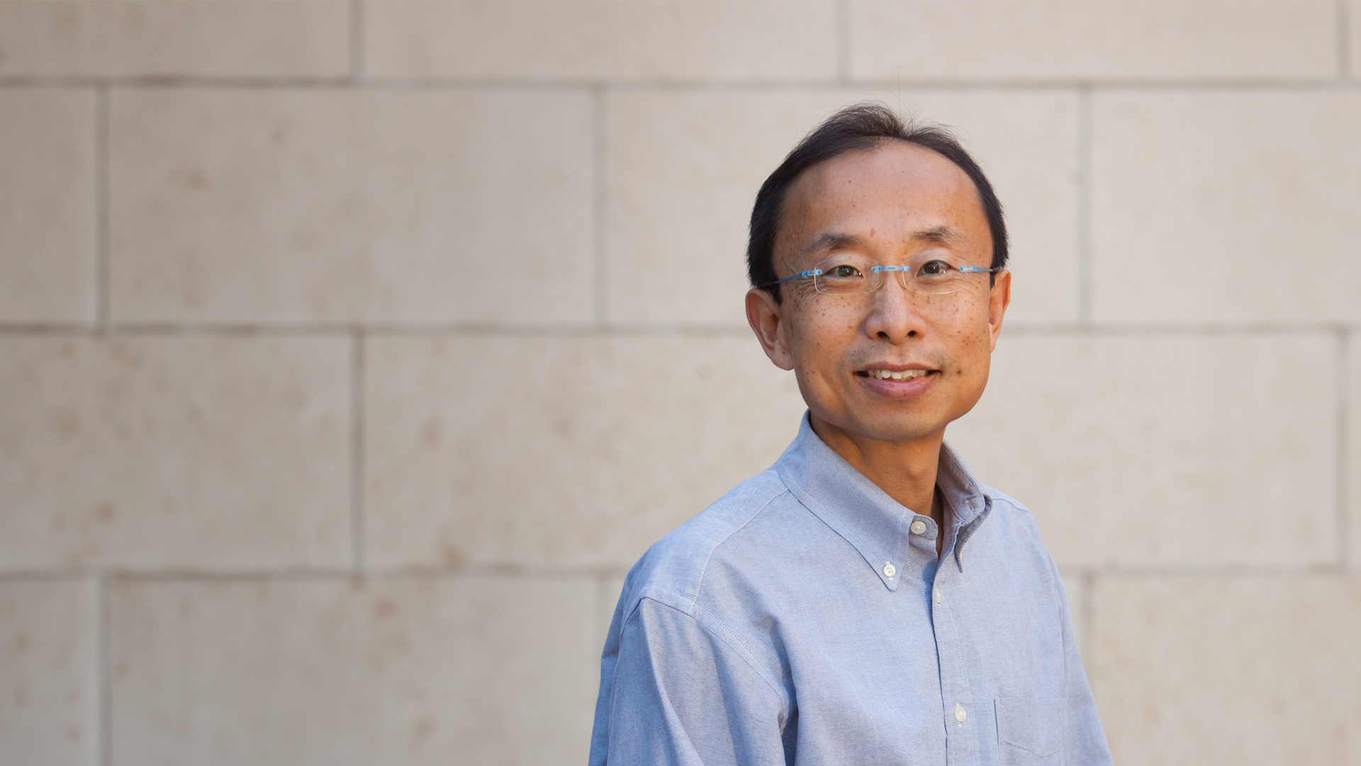 HS Philip wong in front of a brick wall