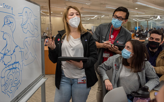 Students at a White Board