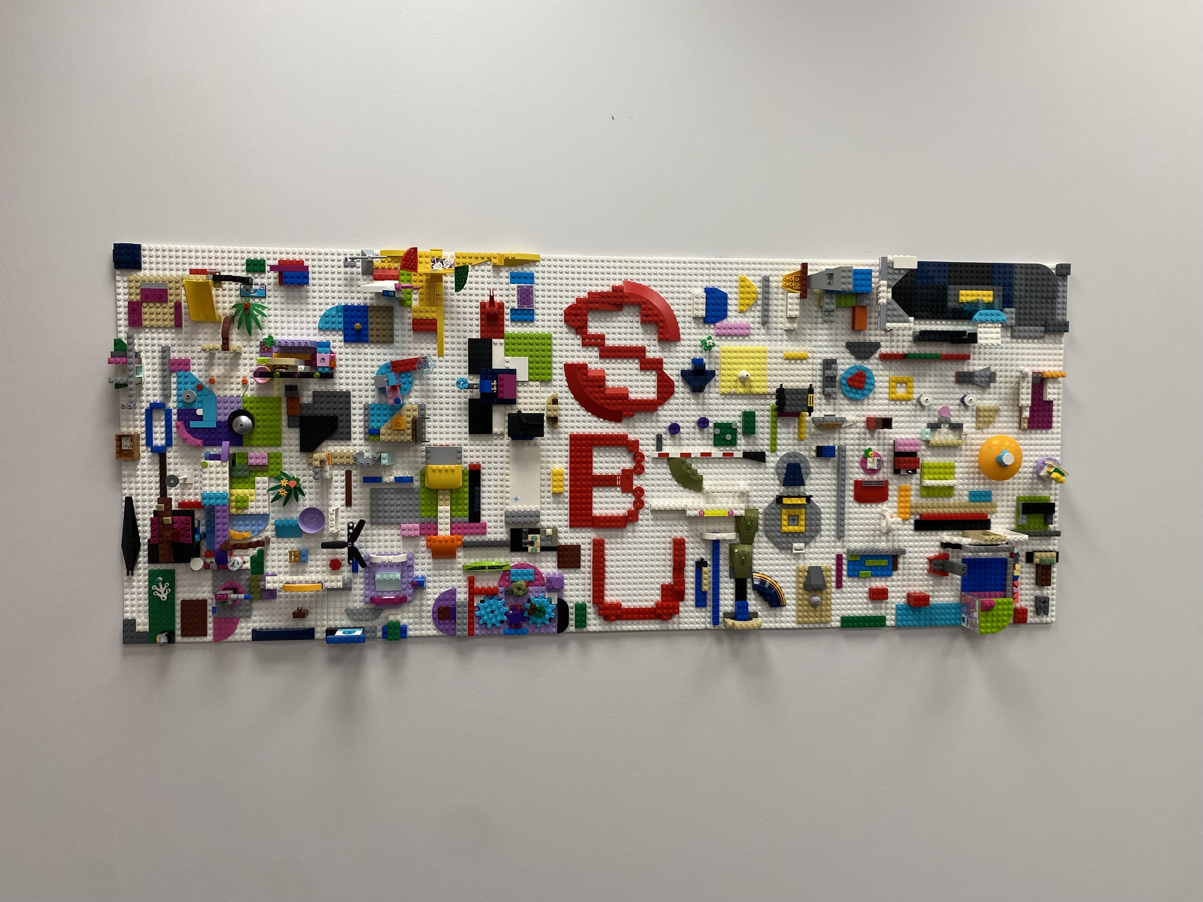 display piece of lego bricks that has abstract design and also has SBU spelled out in the middle