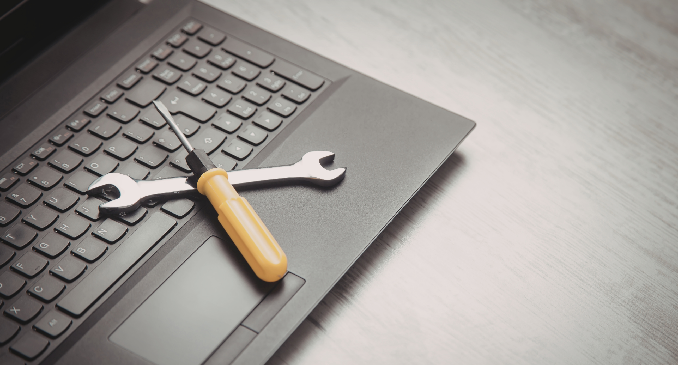 tools laying on laptop ketboard