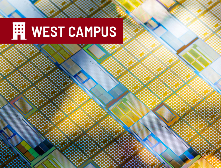 Close-up of a patterned semiconductor wafer used in advanced silicon carbide materials research with "west campus" location overlay