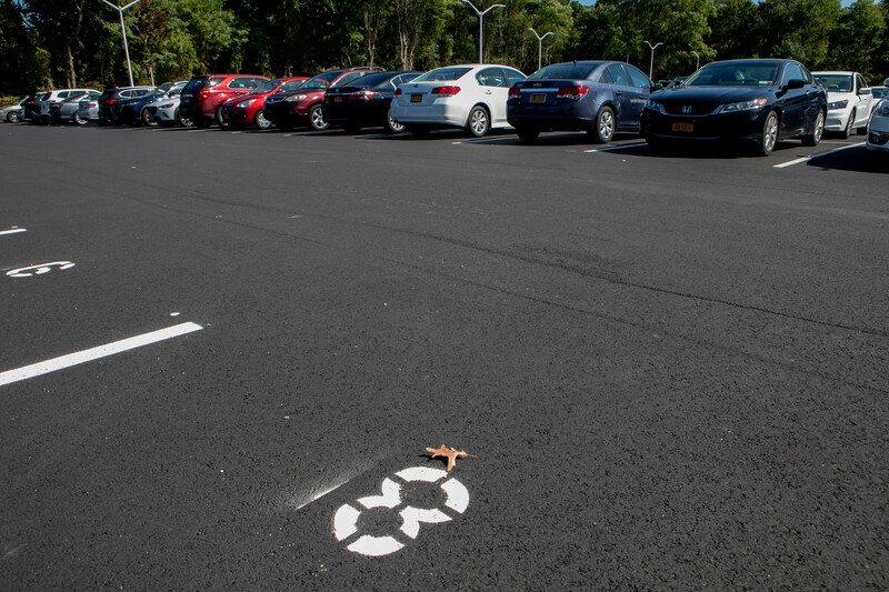 Vehicles parked in a campus parking lot