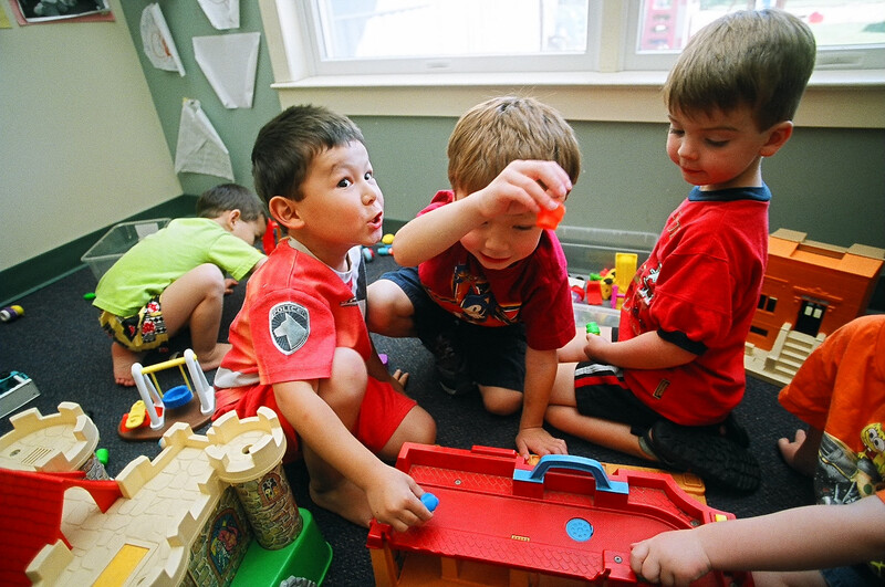 Children playing together in a child care classroom
