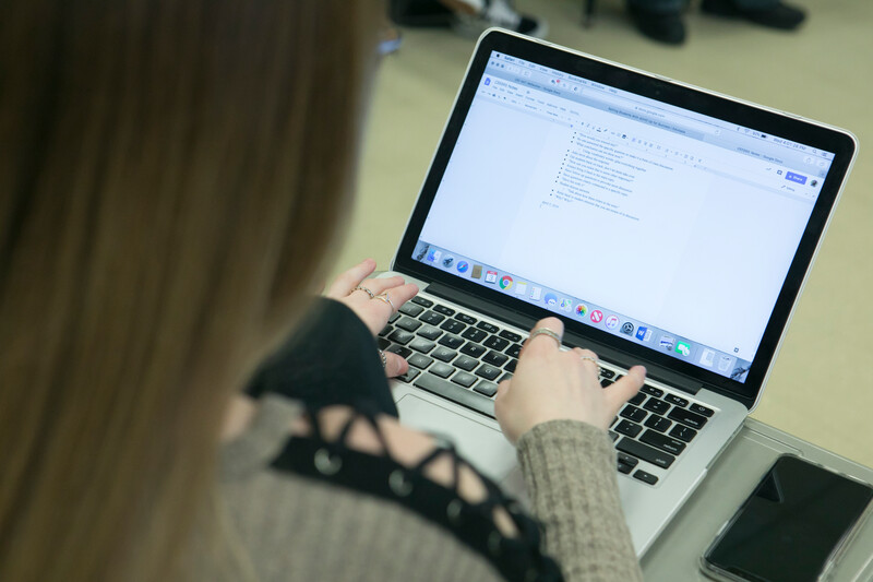 Employee completing training on a laptop