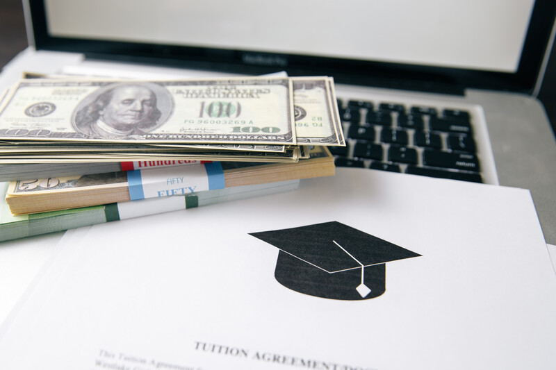 Tuition agreement, currency and a laptop