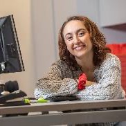 Student sitting at a desk with a computer