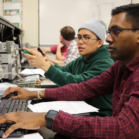 Two students looking at a computer screen