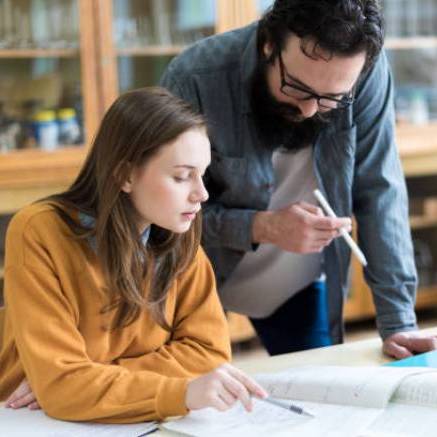 Student and tutor looking at an assignment