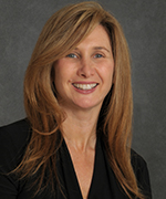 Borrowed portrait of Michelle Ballan; placeholder for fictional Samira Patel