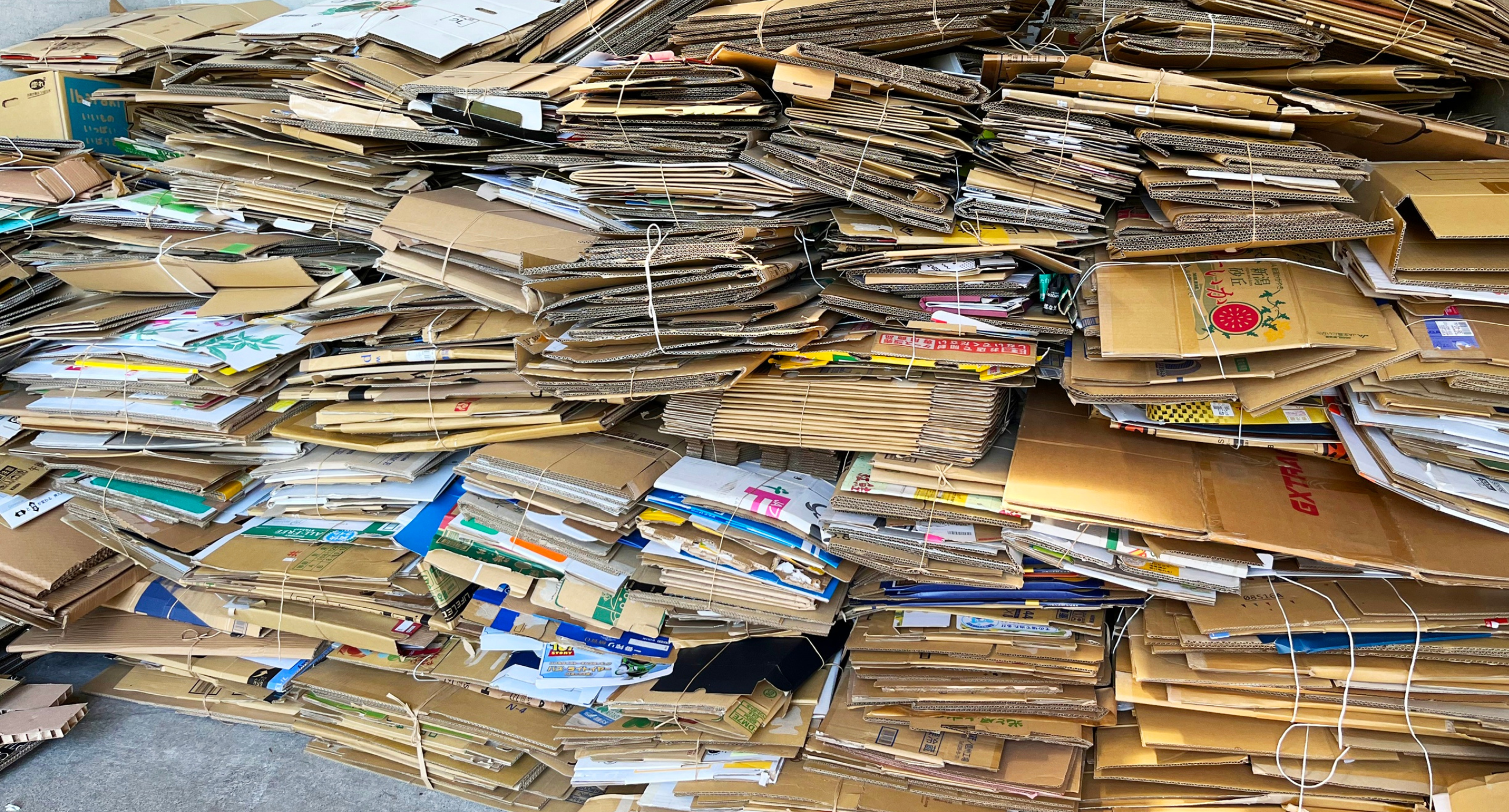 cardboard boxes folded and bunched together in a pile
