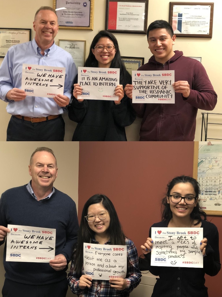 Bob Harrison with student interns holing an "I Love the Stony Brook SBDC" sign