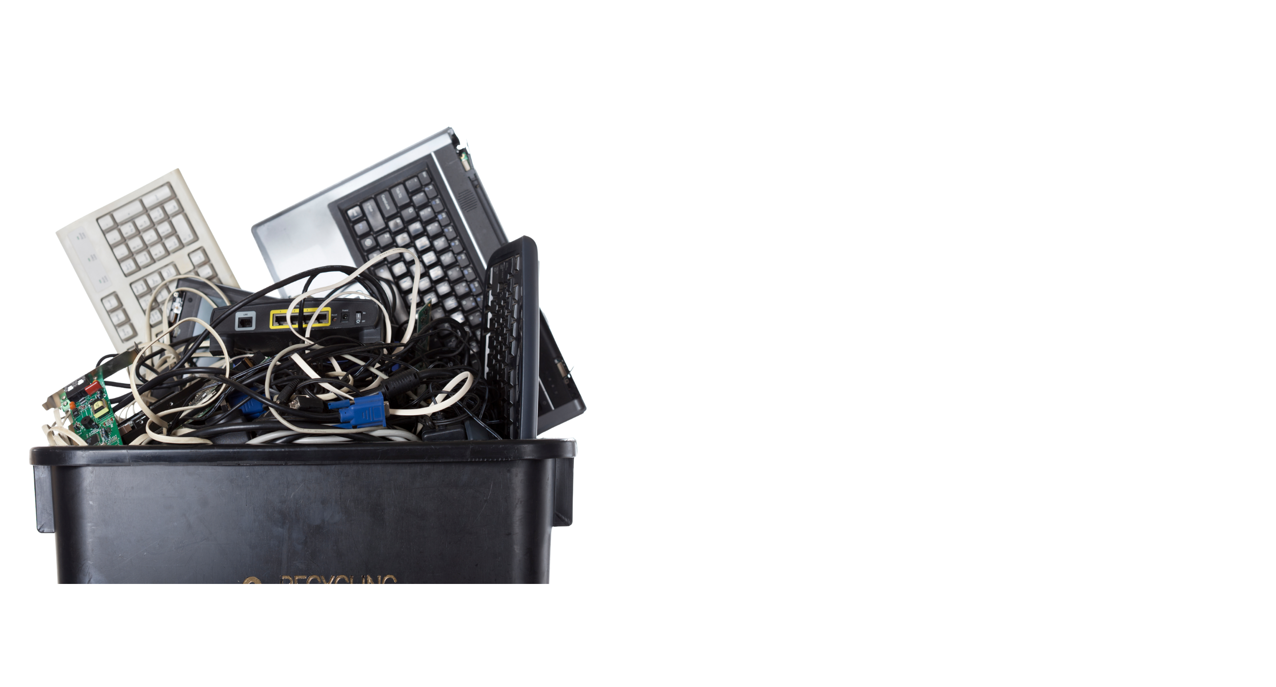 old keyboards and wires in waste basket