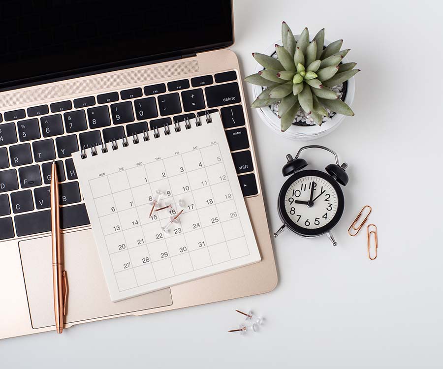 laptop computer with a calendar and clock