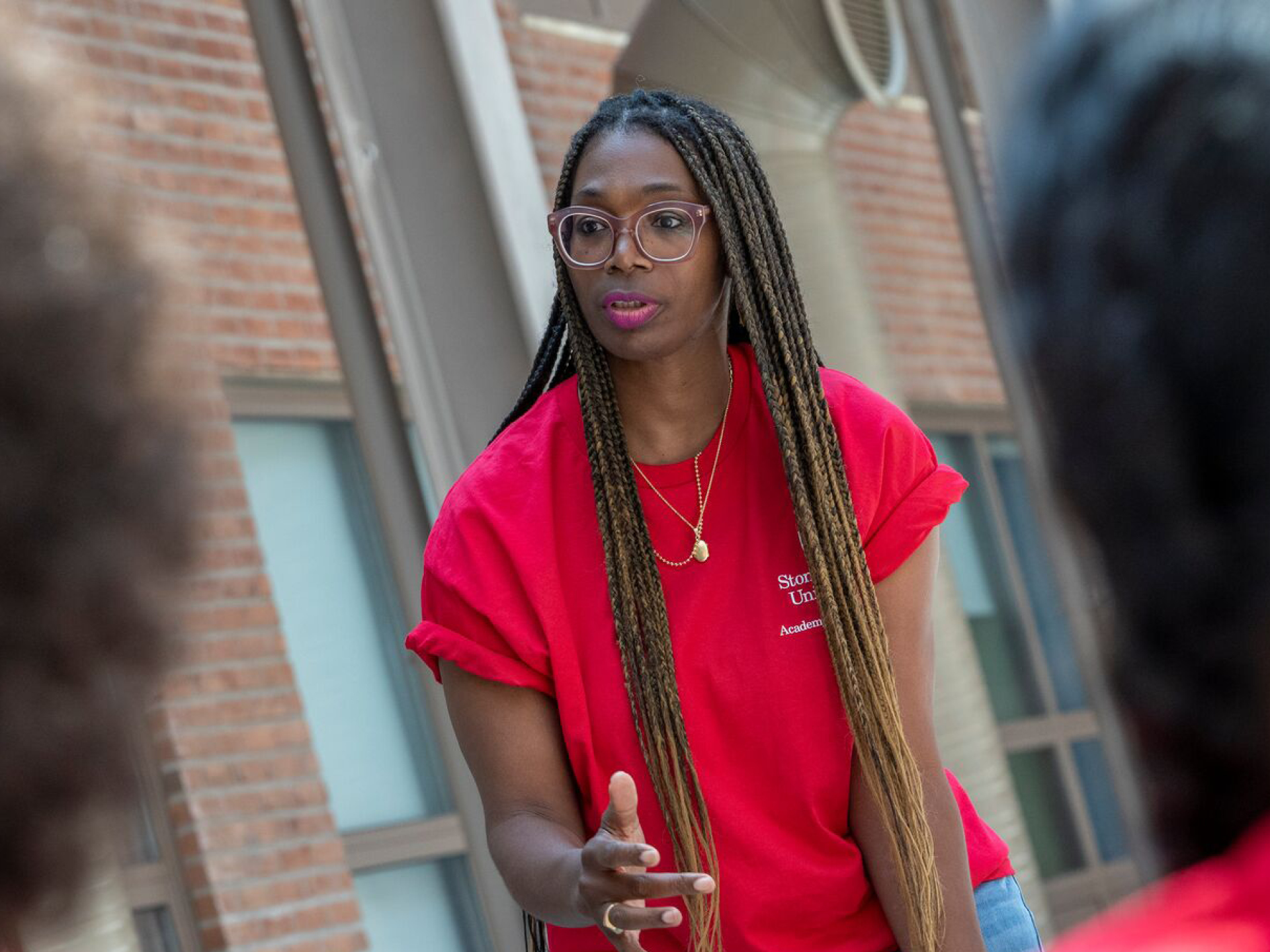 A Stony Brook staff member speaking to students.
