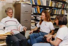 Professor Barry McCoy discussing statistical mechanics with his graduate students, Will Orrick and Anne Schilling.