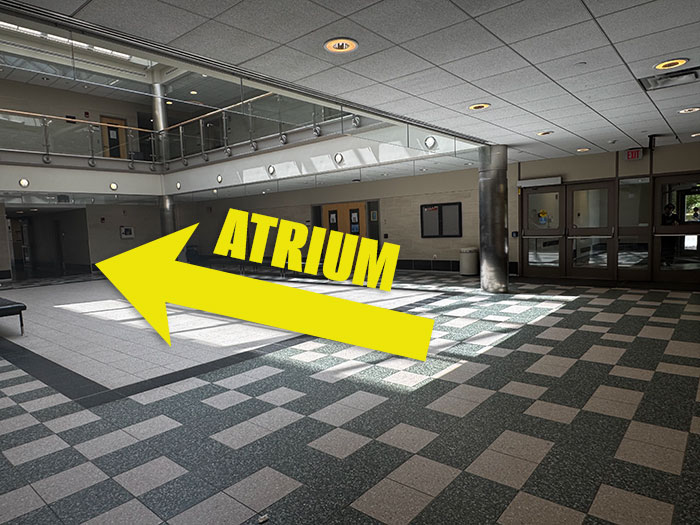 Humanities lobby with a left arrow pointing to the atrium