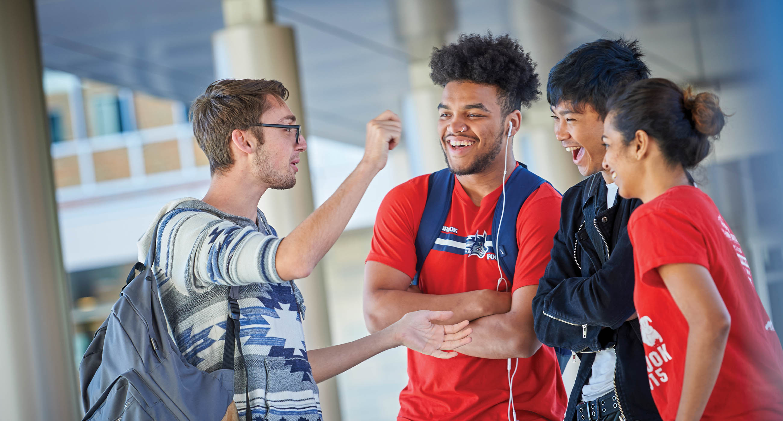 Male students talking on the Staller Steps.