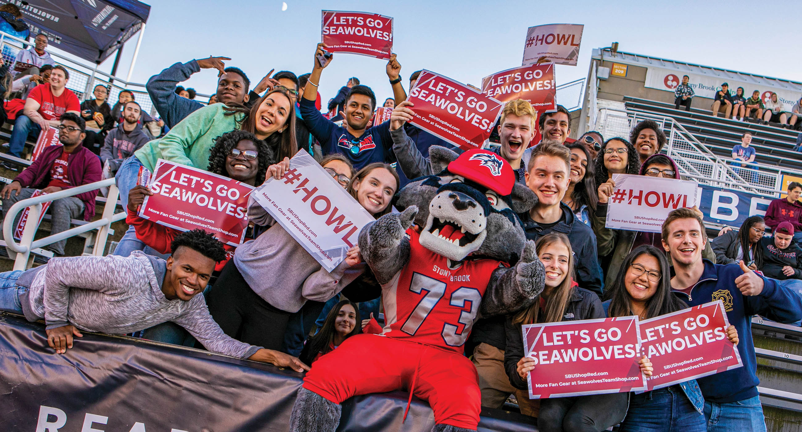 Wolife celebrating with students in Lavalle Stadium.