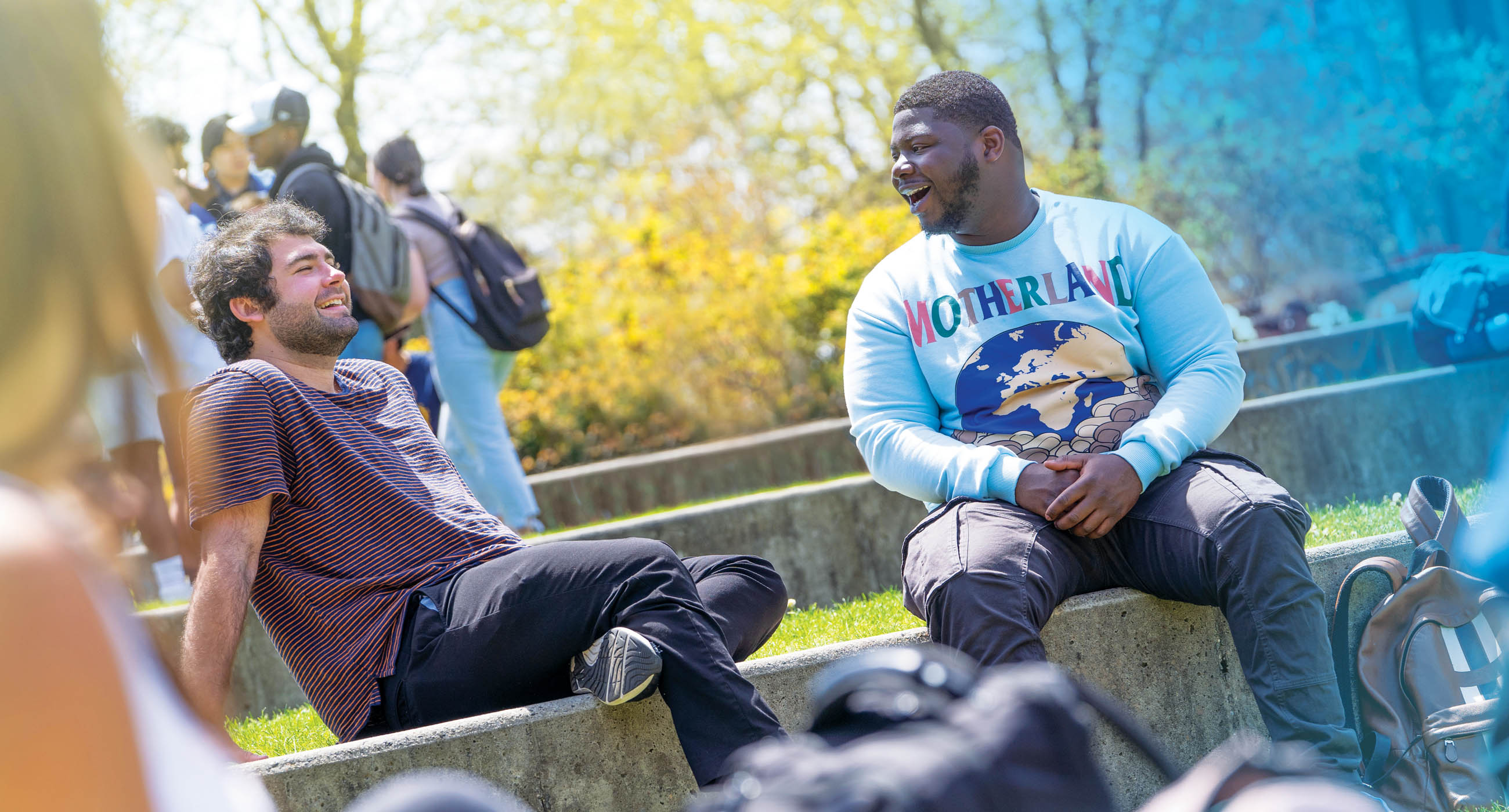 Male students talking on the Staller Steps.