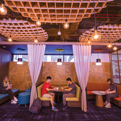 students sit at tables in the UNITI Center