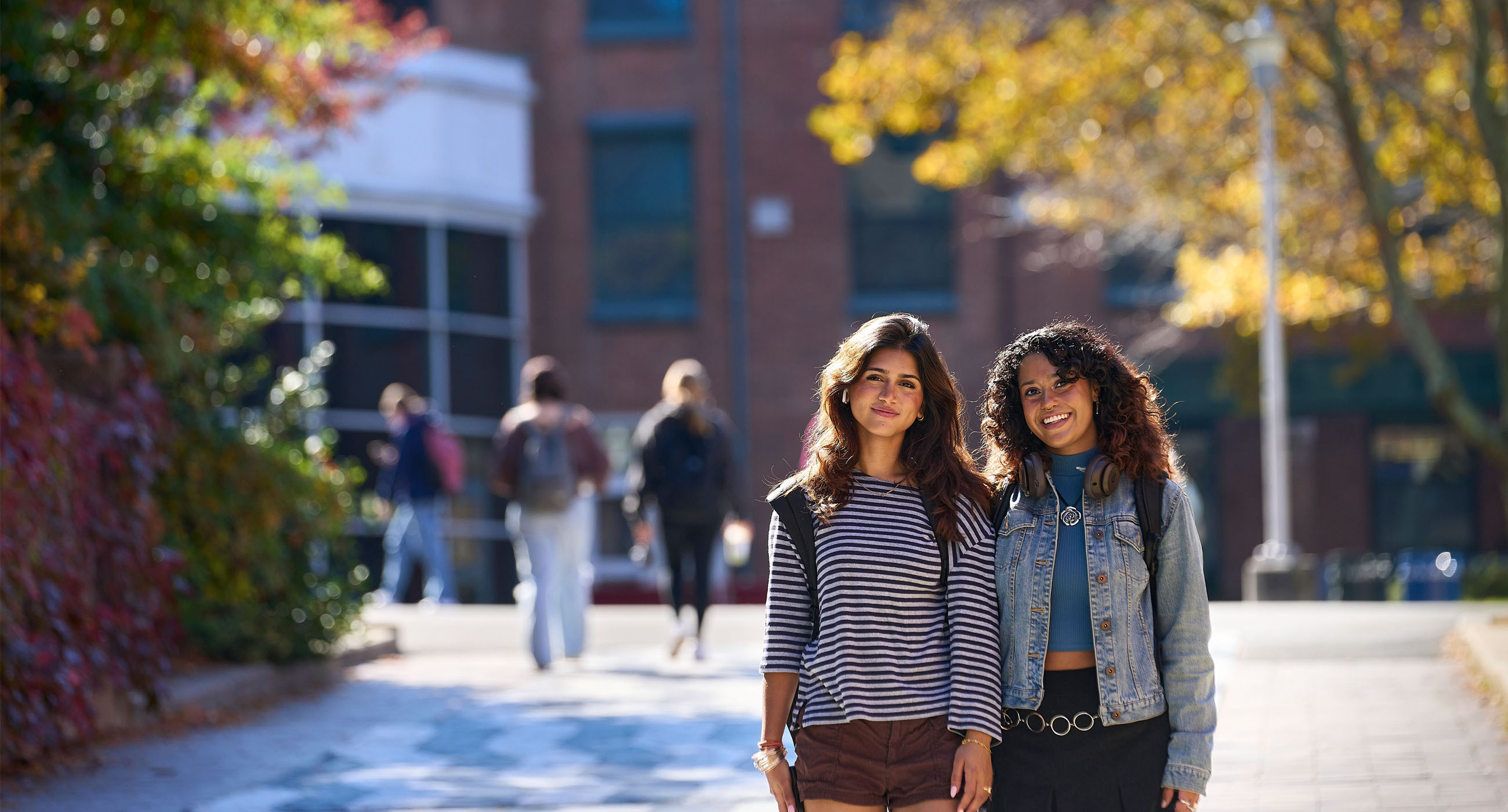 Students posing on the academic mall