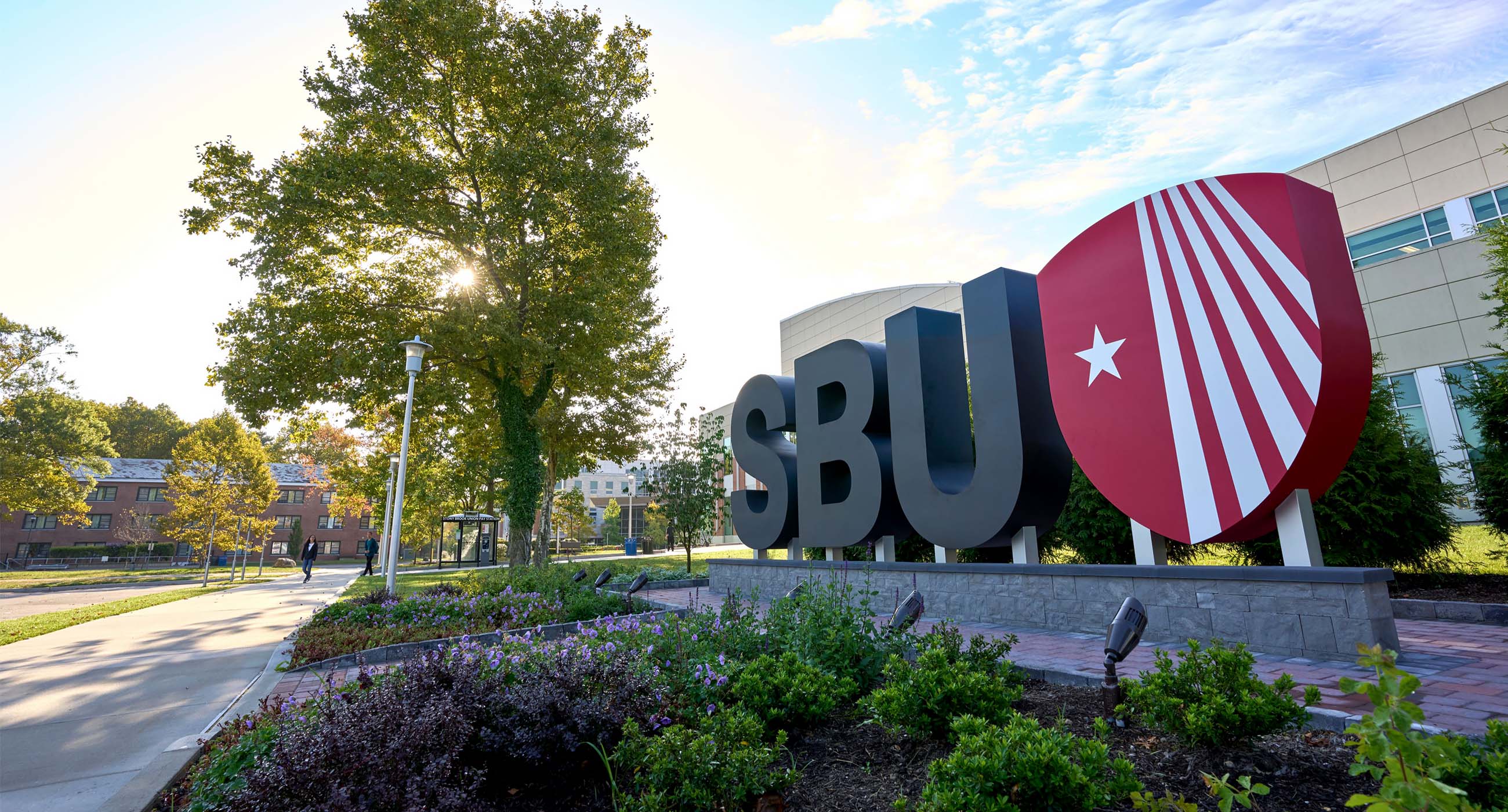Picture of the Stony Brook Campus with the SBU sculpture