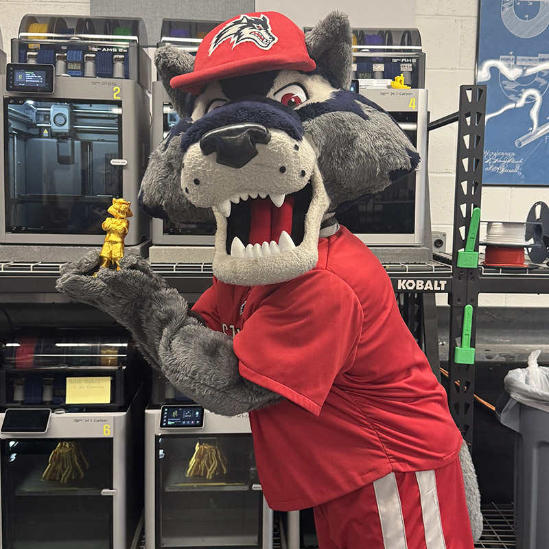 Wolfie with his miniature statue
