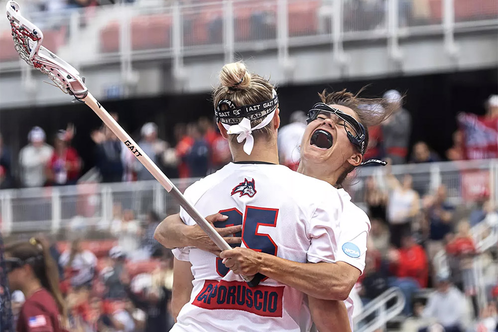 SBU women's lacrosse players celebrate
