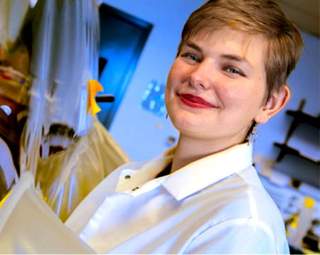 Female undergraduate student conducting research in a laboratory setting